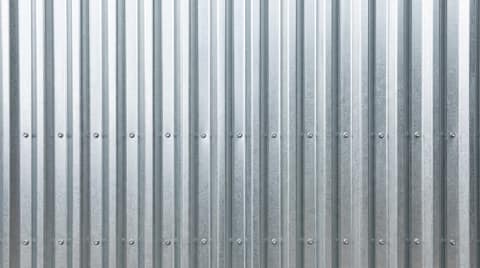 Close-up picture of corrugated metal roofing showing the texture and profile of the material