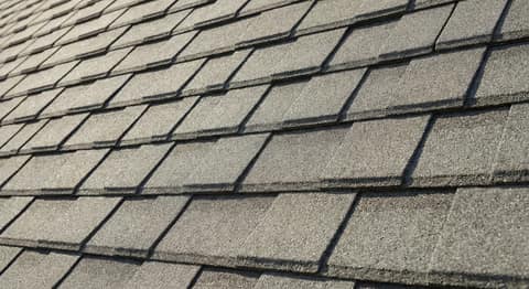 Close-up picture of designer shingle roofing showing the texture and profile of the material