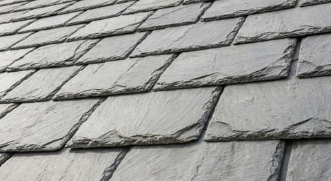 Close-up picture of natural slate roofing showing the texture and profile of the material