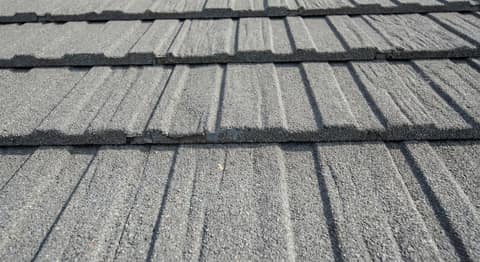 Close-up picture of stone-coated steel roofing showing the texture and profile of the material