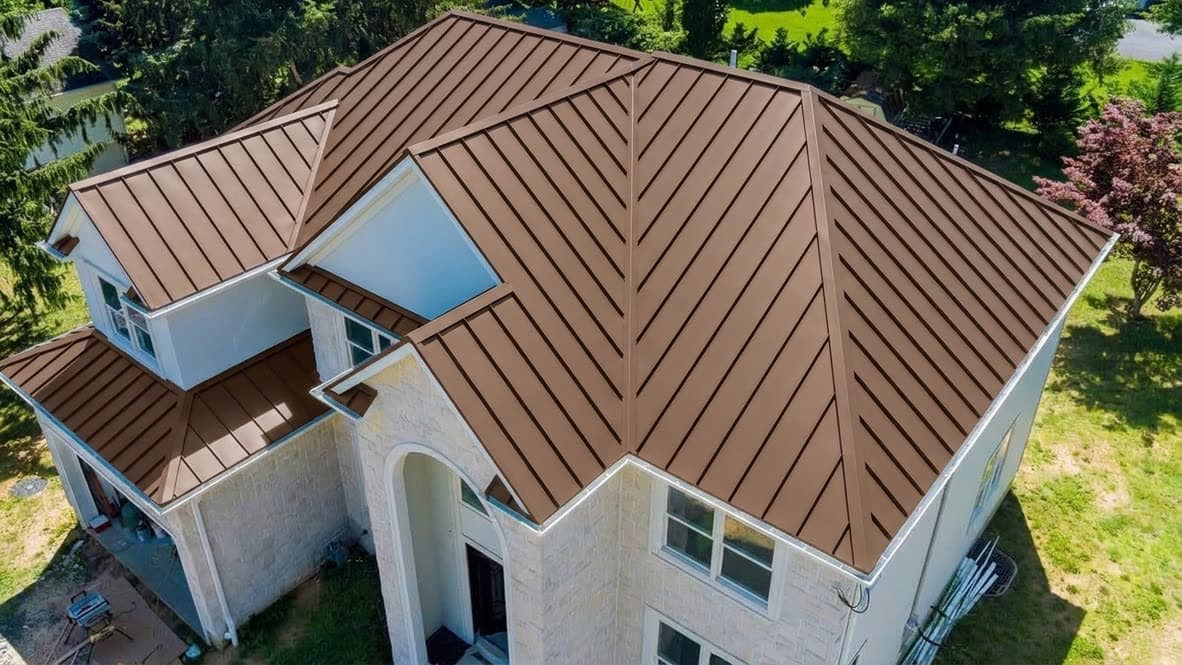 After: Grey shingle to bronze standing seam