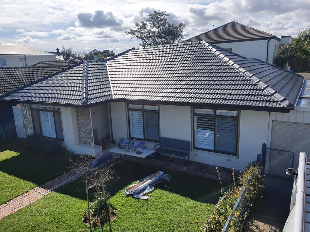 Before: Concrete tile to corrugated metal